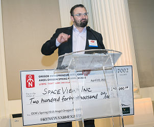 Milos Jovanovic, CEO and Founder, of SpaceView presents his investment prize of $240,000.