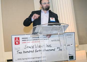 Milos Jovanovic, CEO and Founder, of SpaceView presents his investment prize of $240,000.
